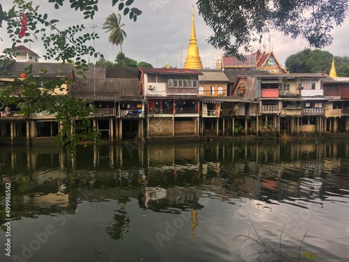 The city of Chantaburi on the lake with a pagoda in the background  photo