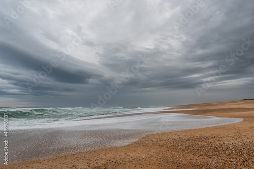 Waves and threatening clouds at Ondres Beach. Landes 