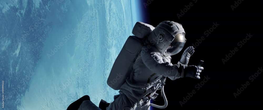 Female astronaut having a video call on her phone while performing space walk in open space, Earth in the background. Shot with 2x anamorphic lens