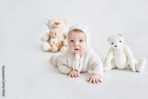 Toddler boy on white background. Child with toys. Happy Birthday! Celebration Happy mother's day. Children's Day. © Aleksandr
