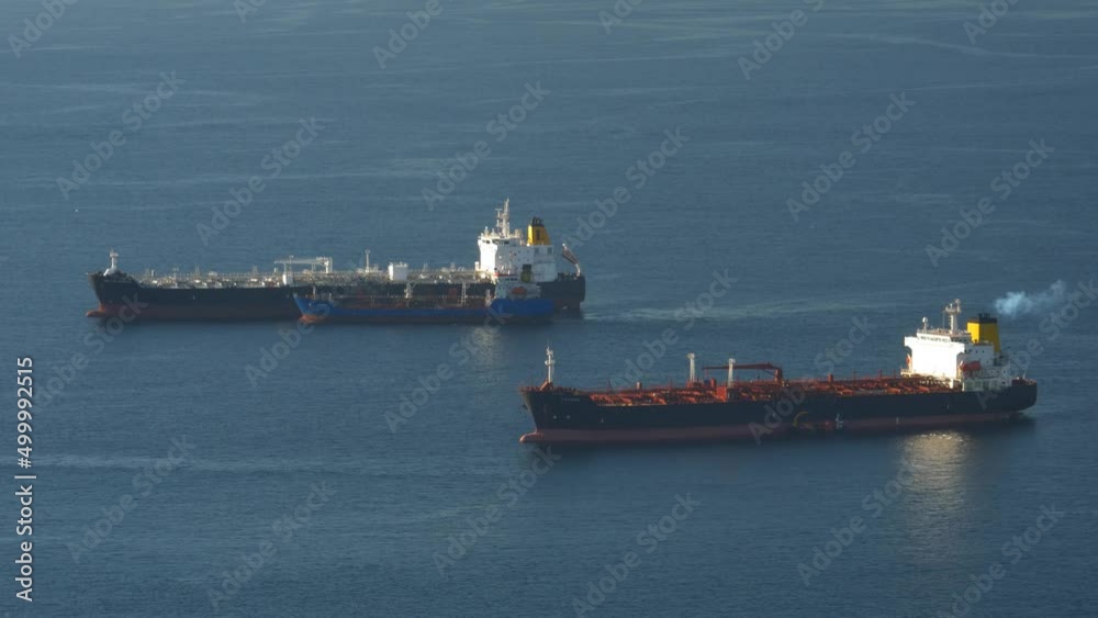Ships anchored off Gibraltar waiting to dock or depart Ships anchored off Gibraltar waiting to dock or depart