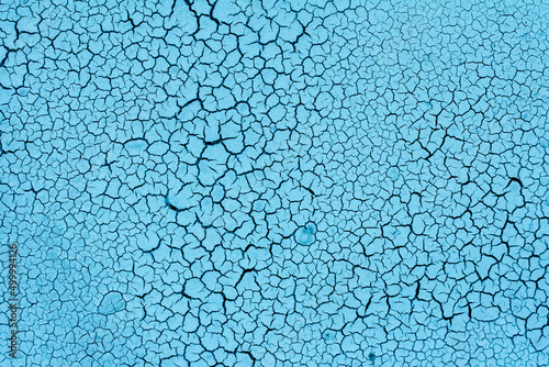 texture of cracks on the wall, small cracks on a blue wall, craquelure effect