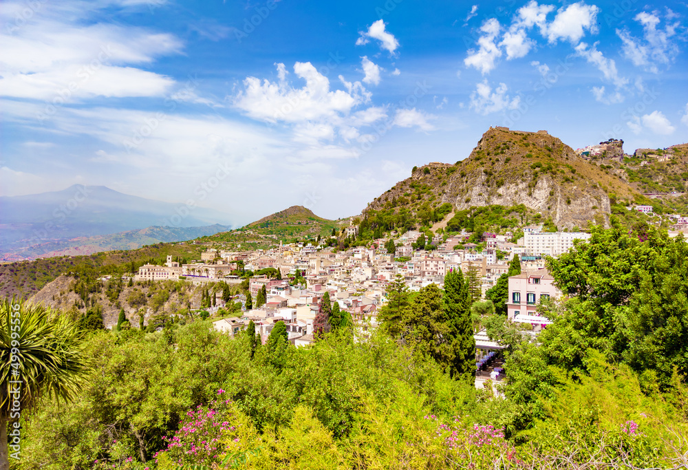 Fototapeta premium Taormina (Sicilia, Italy) - A historical center view of the touristic city in province of Messina, Sicily island, during the summer, famous for Isola Bella beach and the old theatre