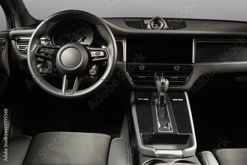 Modern car interior. White leather seats and dashboard inside modern suv © Moose