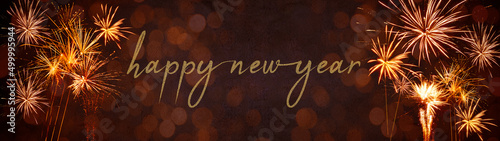 Happy New Year 2023  New Year s Eve Party Silvester background banner panorama long- Golden yellow firework on rustic red stone concrete texture  top view with space for text.