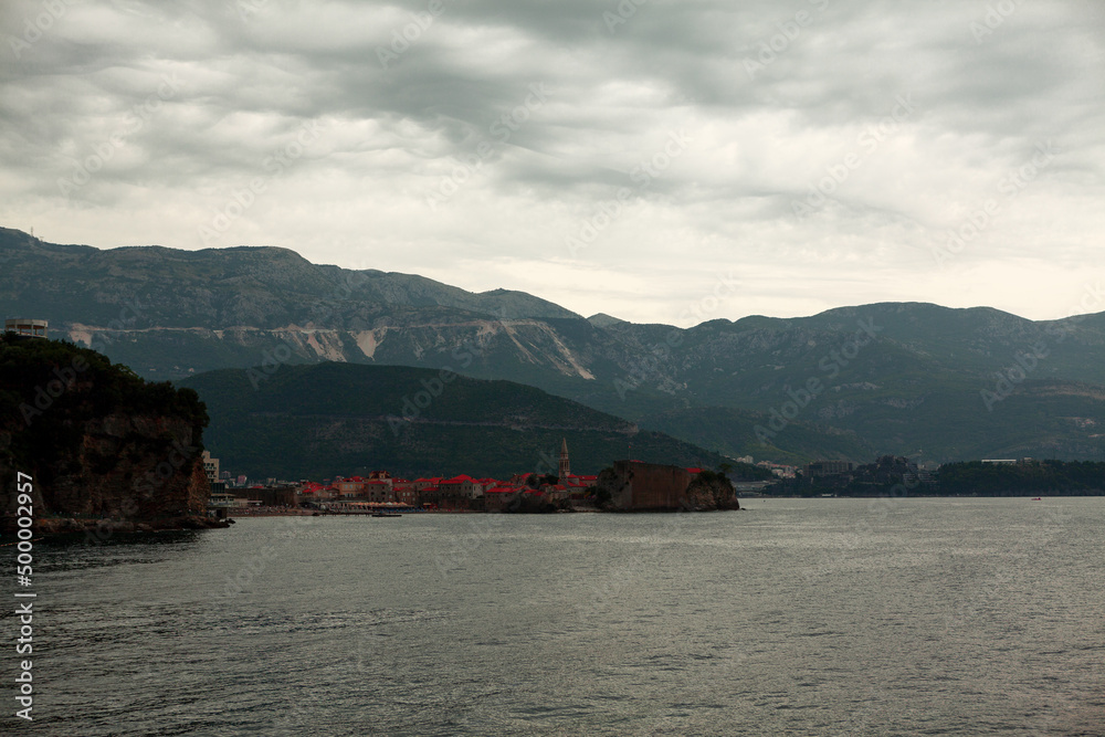 Hurricane clouds over the sea . Torrential rain over Adriatic coast . Heavy rain in Budva Montenegro Hurricane clouds over the sea . Torrential rain over Adriatic coast . Heavy rain in Budva Montenegro