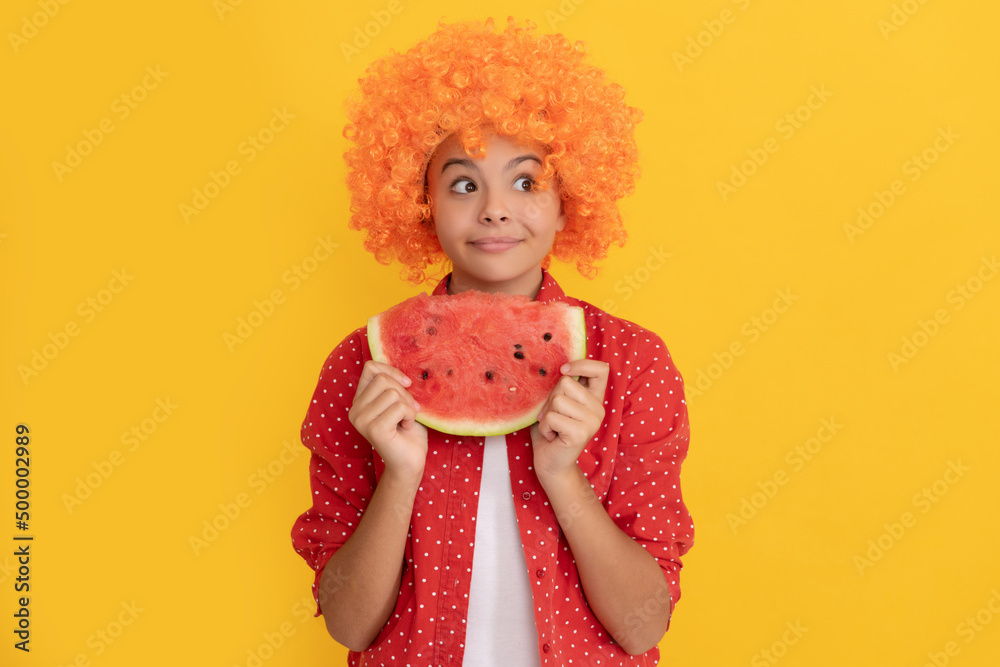fancy teen girl having fun. summertime. face of child with orange hair hold water melon slice fancy teen girl having fun. summertime. face of child with orange hair hold water melon slice