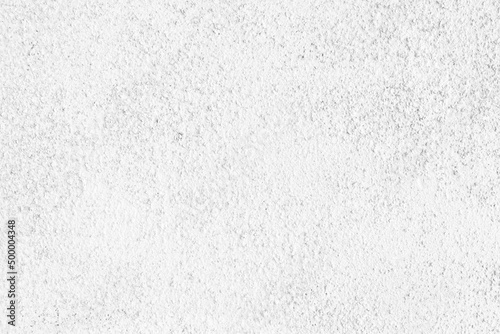 White painted old roughcast exterior wall texture. Whitewashed pebble dash surface abstract background photo