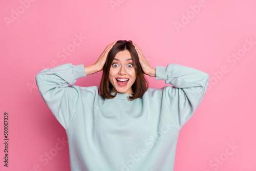 Photo of hooray young lady arms head wear blue shirt isolated on pink color background © deagreez