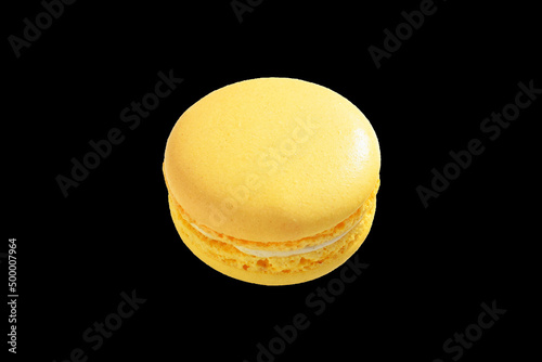 Lemon macaron isolated on black background