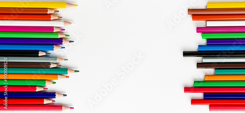 Colorful pencils on white background. Top view, copy space