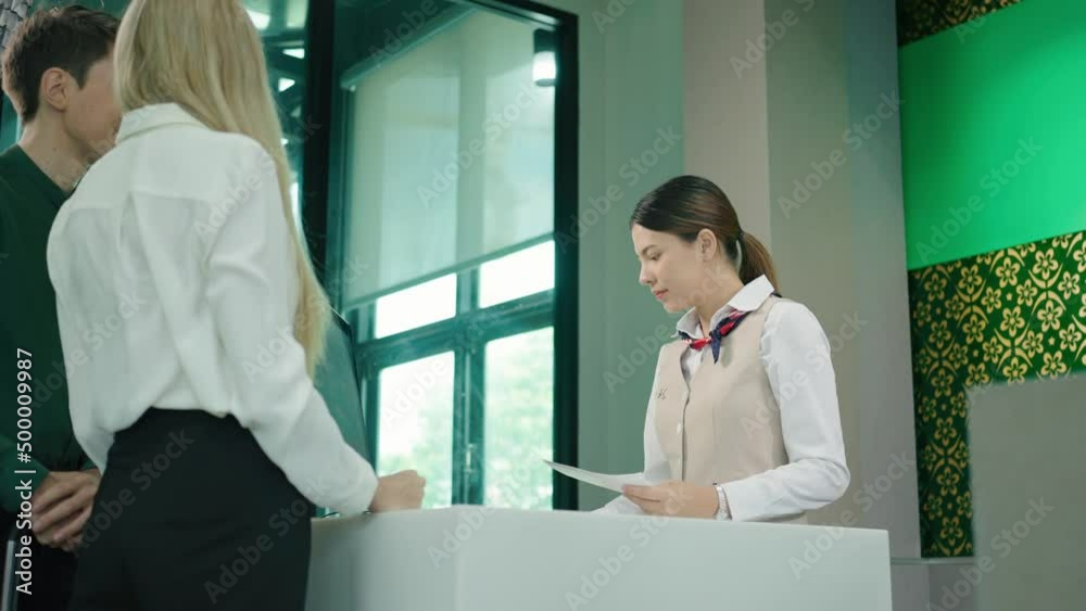 Couple giving flight ticket checke Couple giving flight ticket checke
