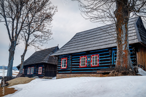 Folk architecture of the distinctive village of Zdiar at winter. High Tatras ...
