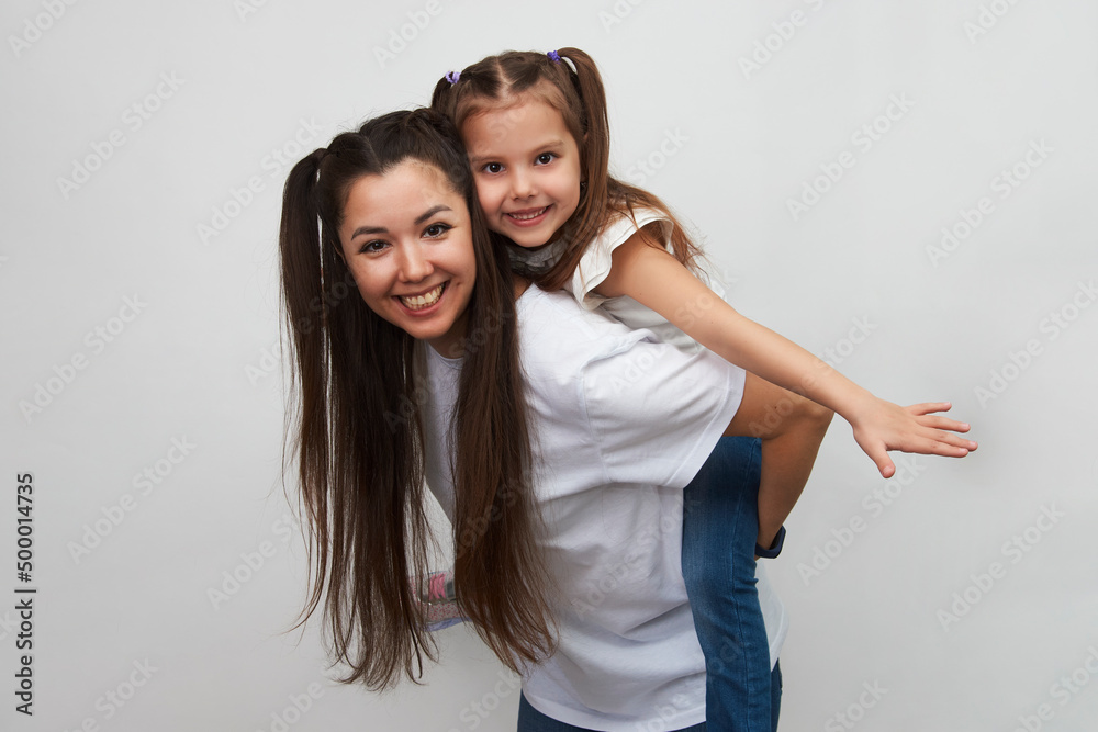 Happy woman and child girl 5-6 years old having fun Happy woman and child girl 5-6 years old having fun