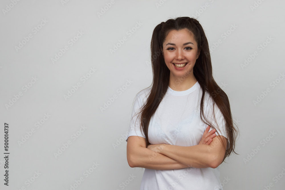 Smiling woman pointing up on white background Smiling woman pointing up on white background