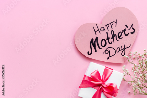 Women mothers day concept with pink ribbon fift box
