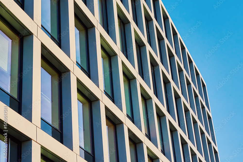 Building facade with geometric pattern. Modern architecture. Residential building in europe city Building facade with geometric pattern. Modern architecture. Residential building in europe city