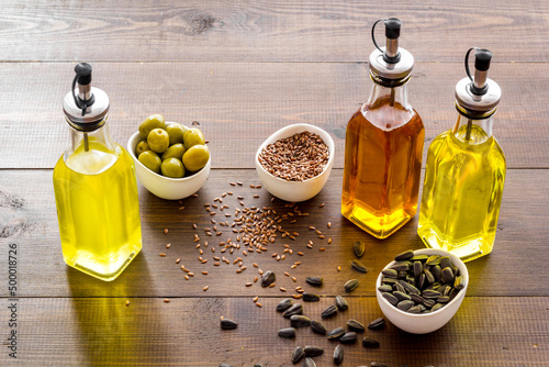 Vegetarian cooking oil in bottles. Sunflower olive and sesame oil with ingredients