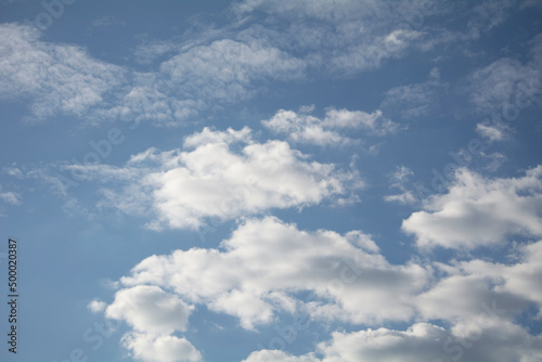 White clouds in the blue sky.