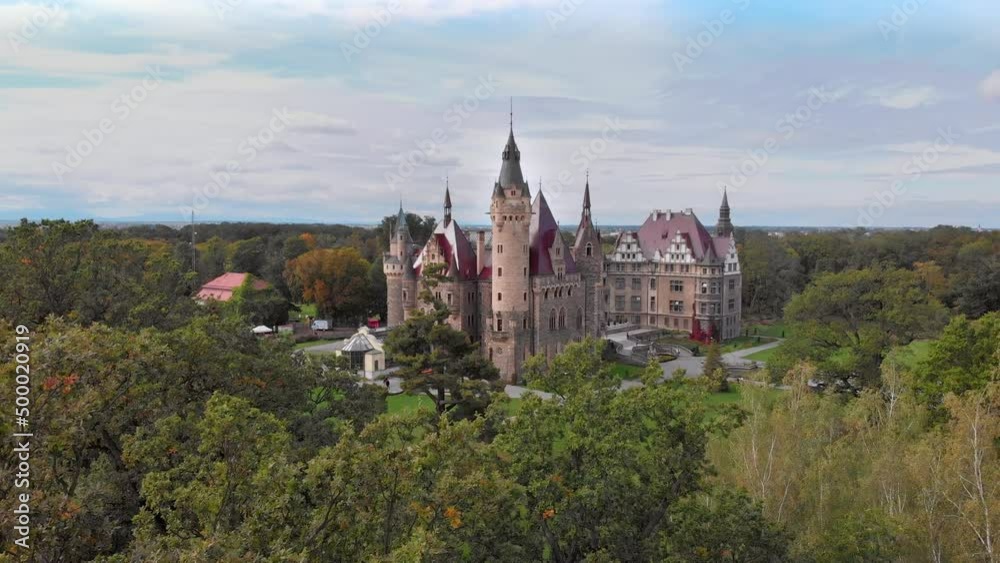 Aerial view historic castle in Moszna near Opole, Silesia, Poland. Built in XVII century, One of the best known and most beautiful monuments in Upper Silesia. Aerial view historic castle in Moszna near Opole, Silesia, Poland. Built in XVII century, One of the best known and most beautiful monuments in Upper Silesia.