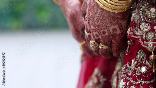 close up of the hands of a middle eastern woman covered in henna tattoos. Culture photo