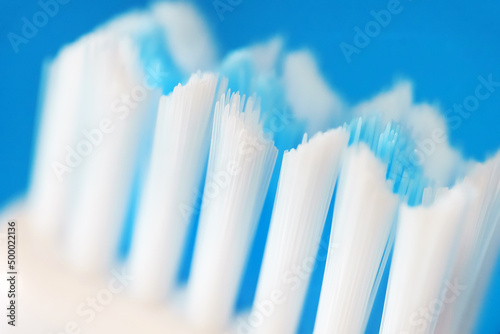 Obraz na plátně Electric ultrasonic toothbrush bristles on blue background.