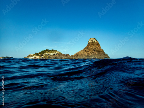 Isola Lachea e faraglioni di Acitrezza photo