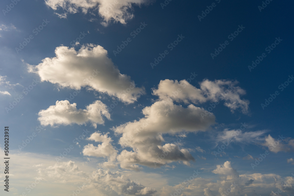 Obraz premium Sunny day, blue sky and white clouds