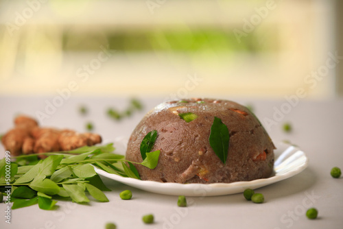 Raagi upma,multi millet upma south indian famous breakfast closeup with selective focus and blur photo