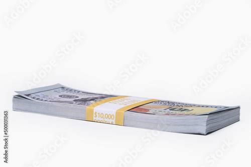Fotografie Stack of ten thousand American dollars isolated on white background