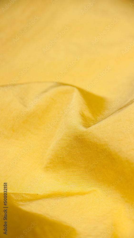 Detalle de chándal de polyester de color amarillo Stock Photo | Adobe Stock