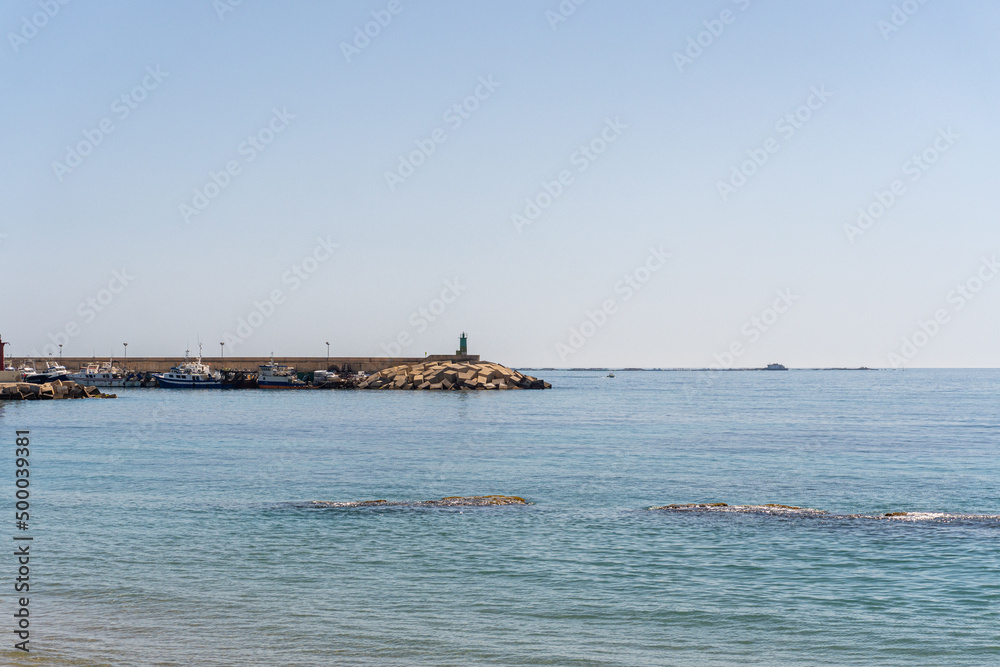 Views of the lighthouse and the port of La Villajoiosa, Alicante (Spain).