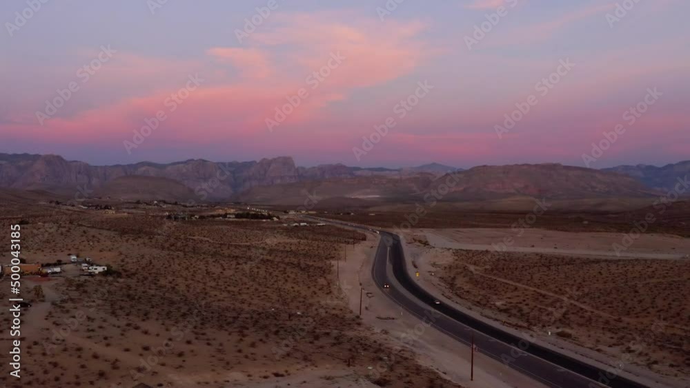 Aerial drone view of traffic on a road, in Red rock, during dusk, in Arizona, USA Aerial drone view of traffic on a road, in Red rock, during dusk, in Arizona, USA