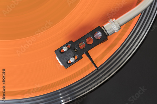 Fotografie Orange Vinyl on recordplayer