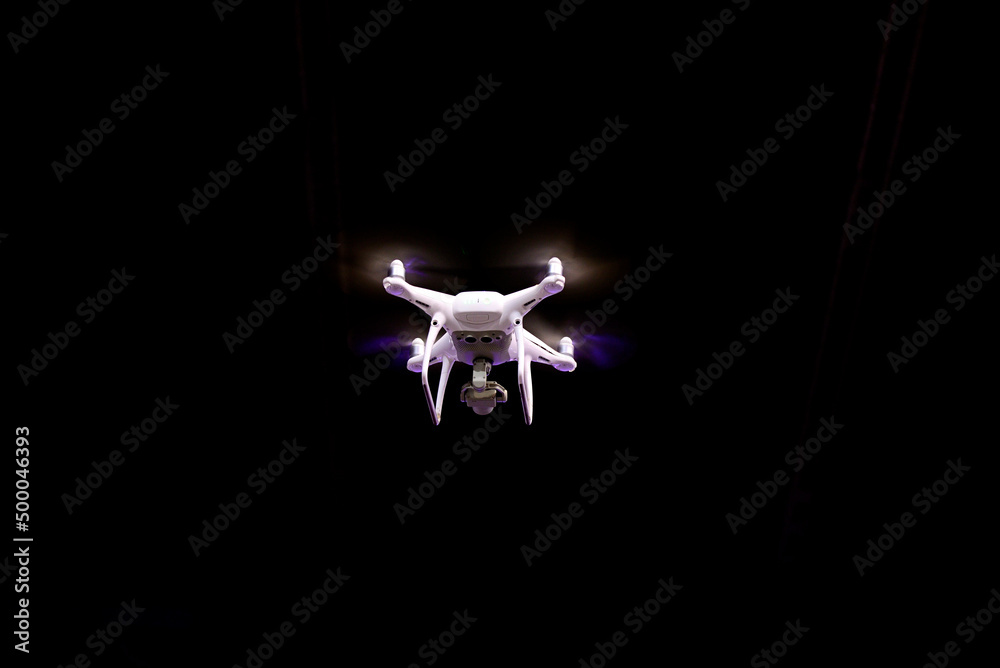 Fototapeta premium Drone is flying against isolated black background