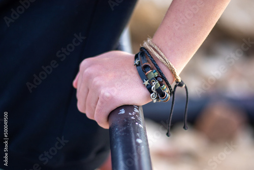 Side look of a hand with a Bala or Kada bracelet on a fist photo