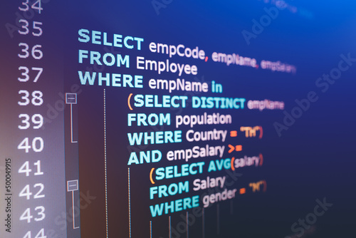 SQL (Structured Query Language) code on computer monitor. Example of SQL code to query data from a database. photo