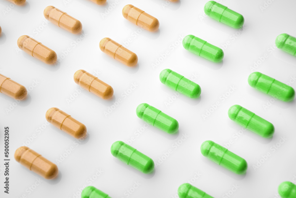 Vitamins. Fish Fat Oil Capsules. Fish oil capsules isolated on white background. Close up of capsules Omega 3 on white background. Health care concept. Nutritional supplements.