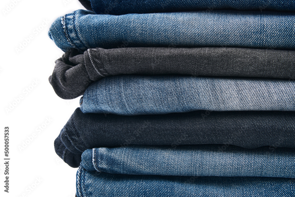 Stack of Various Shades Of Blue Jeans On White Background Denim jeans texture. Denim background texture for design. Canvas denim texture. Blue denim that can be used as background. Stack of Various Shades Of Blue Jeans On White Background Denim jeans texture. Denim background texture for design. Canvas denim texture. Blue denim that can be used as background.