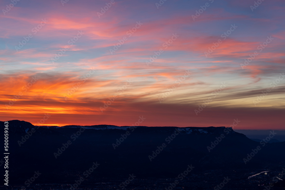 red could during sunset in the mountains