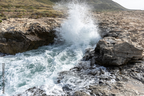 SEA WAVES BREAKING ON ROCKS 