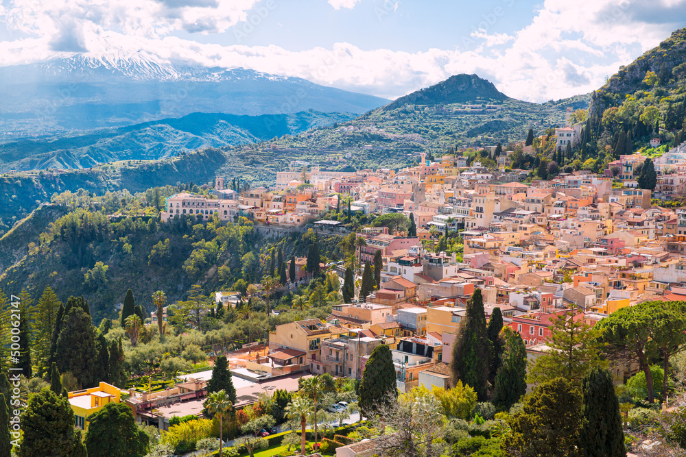 Taormina town panoramic view and Vesuvius mountain in Sicily island, Italy. Beautiful summer day.  