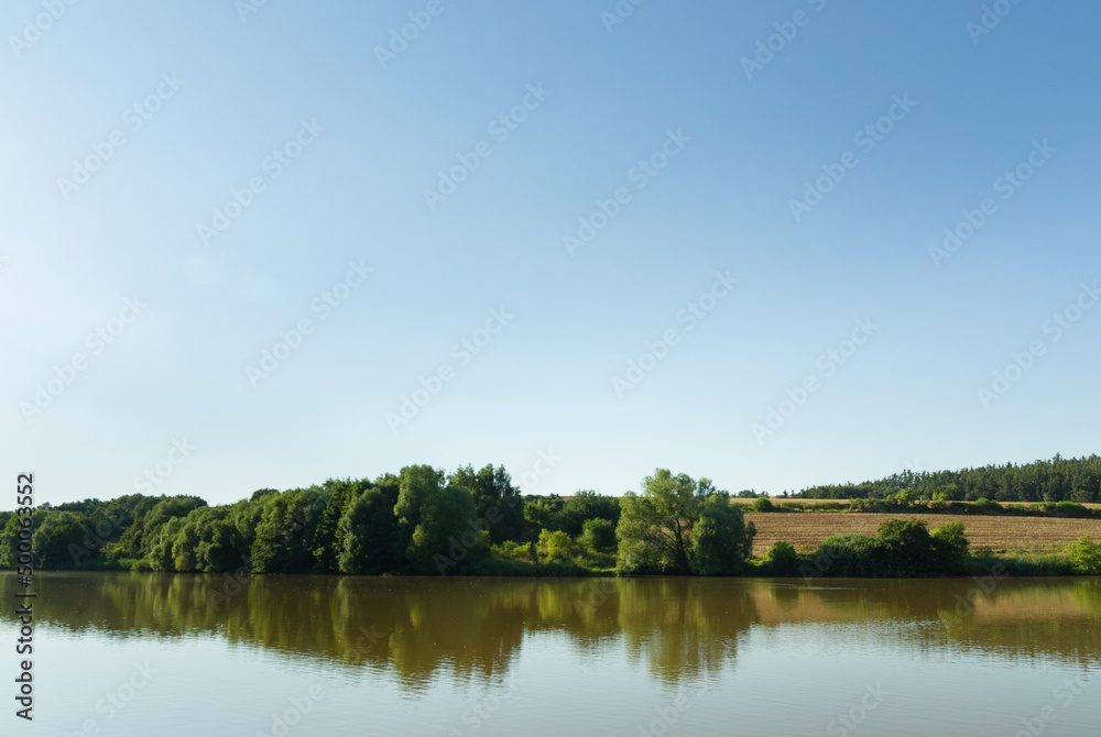 Natural fishing pond in summer, rural Czech Republic