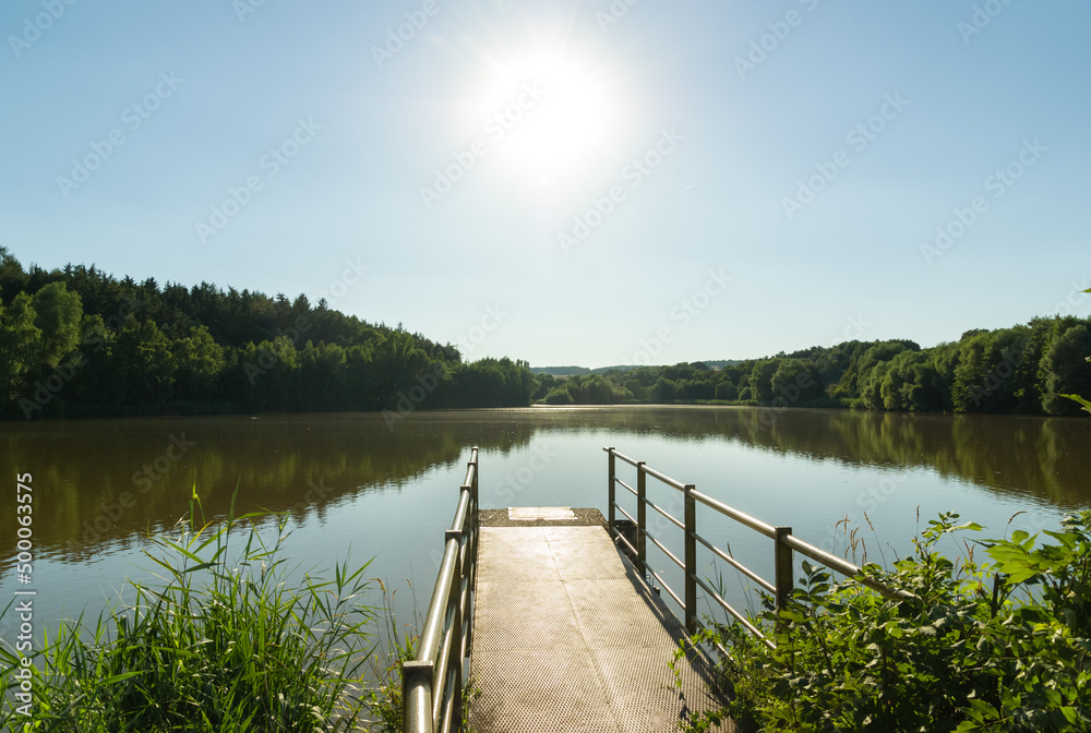 Large pond with jetty in summer, rural Czech Republic