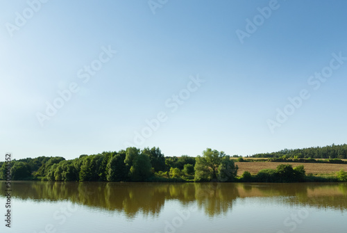 Fototapeta Naklejka Na Ścianę i Meble -  Natural fishing pond in summer, rural Czech Republic