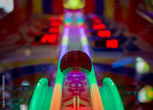 Low angle shot of a colorful arcade pinball game machine in Brighton photo