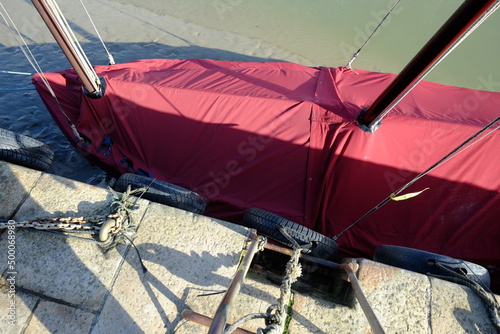 A close-up on a sailing boat protected for the winter.