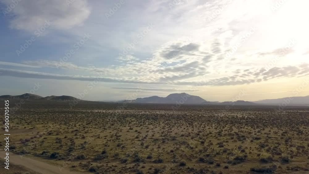 Stunning nature flat landscape.
Perfect aerial view flight slider fly sideways from right to left drone footage Mojave desert Valley USA 2018. Cinematic nature view from above by Philipp Marnitz