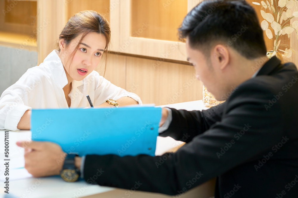Businesswoman working with manager in room at office and eye contact to describer Businesswoman working with manager in room at office and eye contact to describer