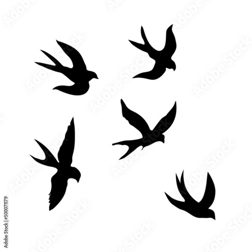 Swallows. Black silhouette on a white background. Silhouette of a swarm of swallows. Black contours of flying birds. Flying swallows. Tattoo vector illustration isolated on white background. © Liubov